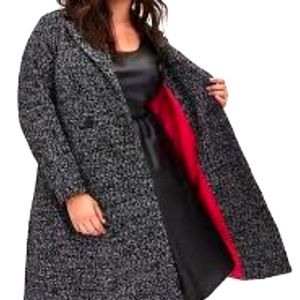 Black & white boucle statement coat with hot pink lining.